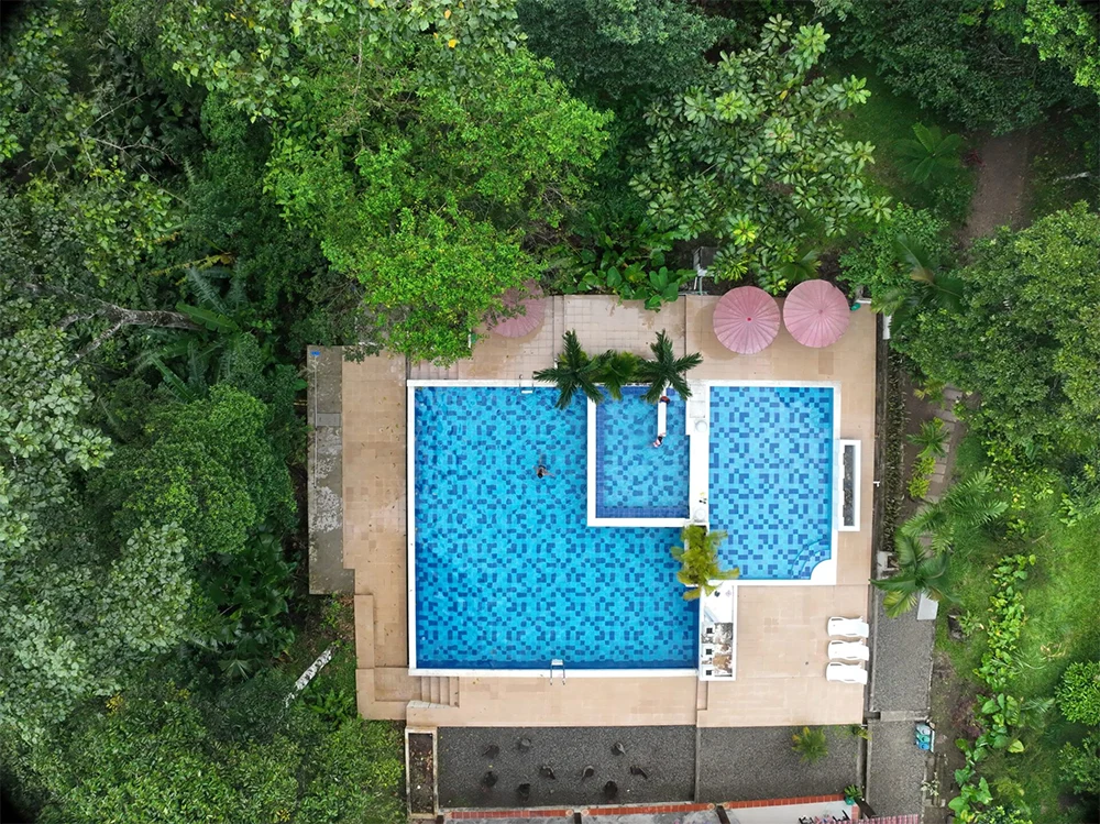 Swimming pool at Mahadevi Ayahuasca Retreat in Putumayo, Colombia surrounded by Amazon rainforest