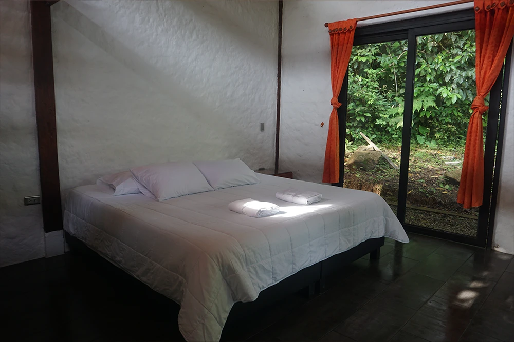 Private jungle cabin exterior at an ayahuasca retreat in Colombia