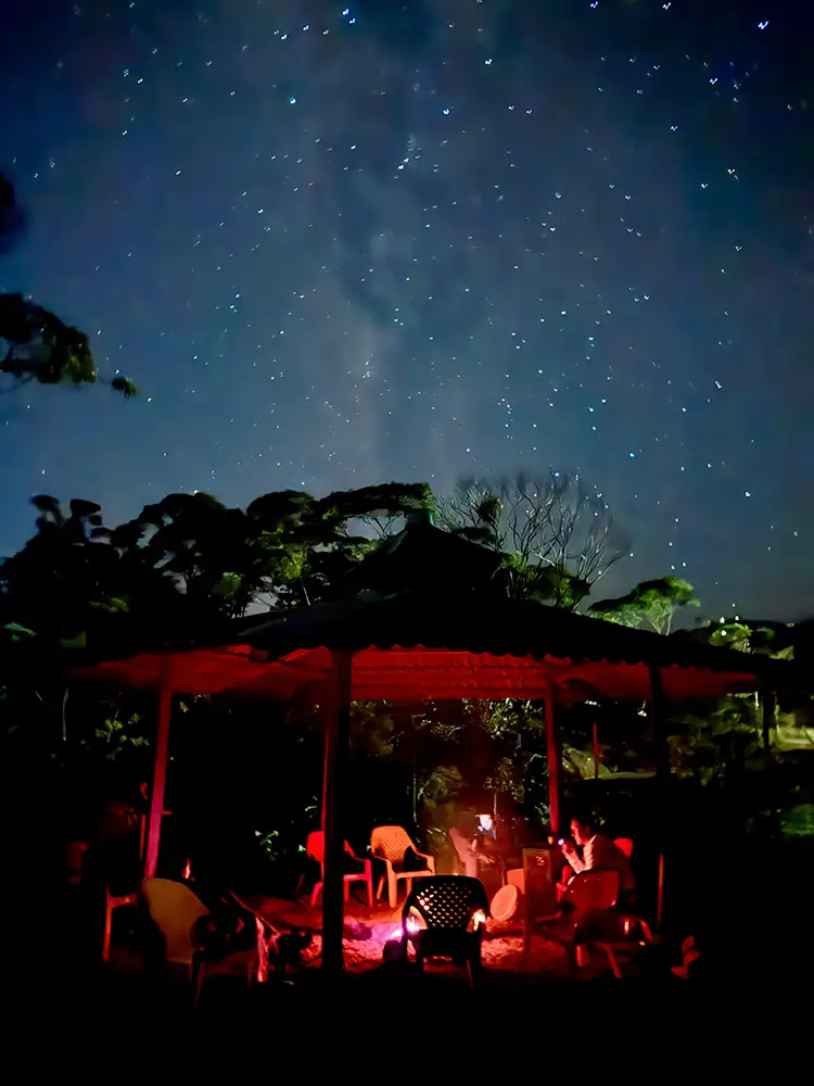 Night Yagé ceremony at MahaDevi maloka in Putumayo Colombia — fire, darkness and ancestral songs