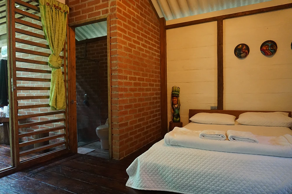 Interior view of a jungle cabin at Mahadevi Ayahuasca Retreat in Colombia