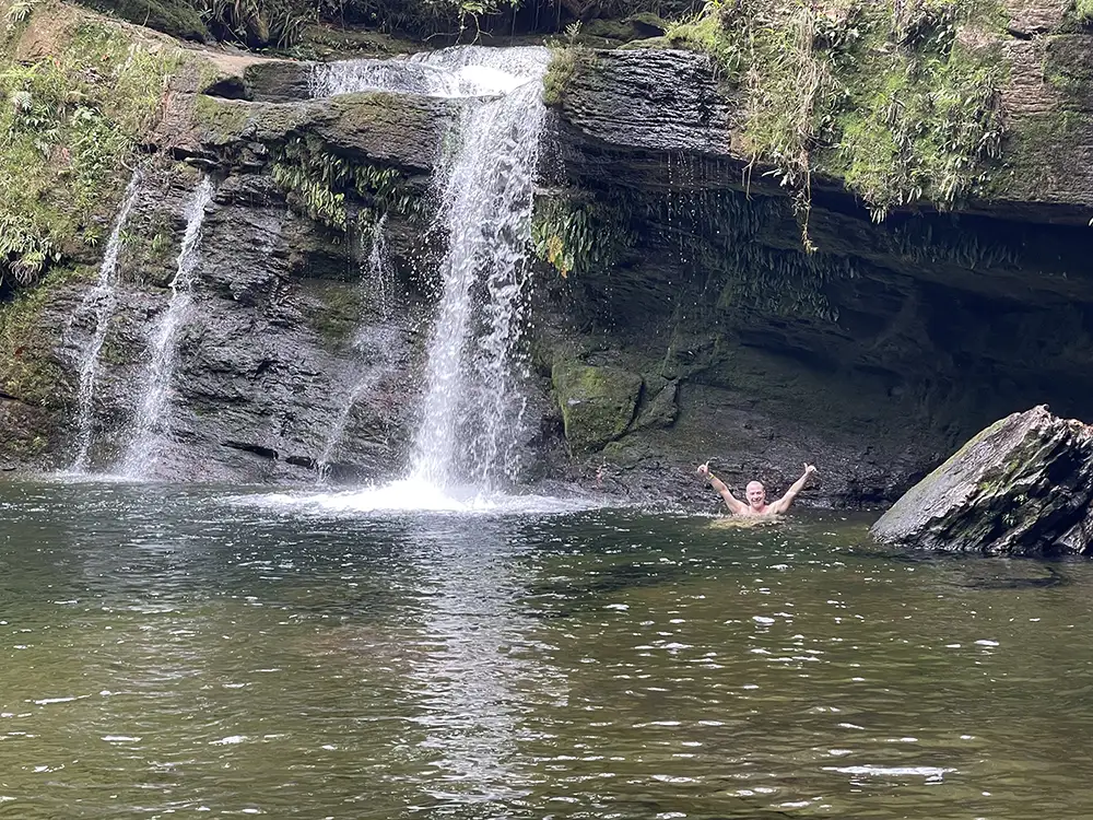 Swimming at Fin del Mundo waterfall during MahaDevi ayahuasca retreat Putumayo Colombia