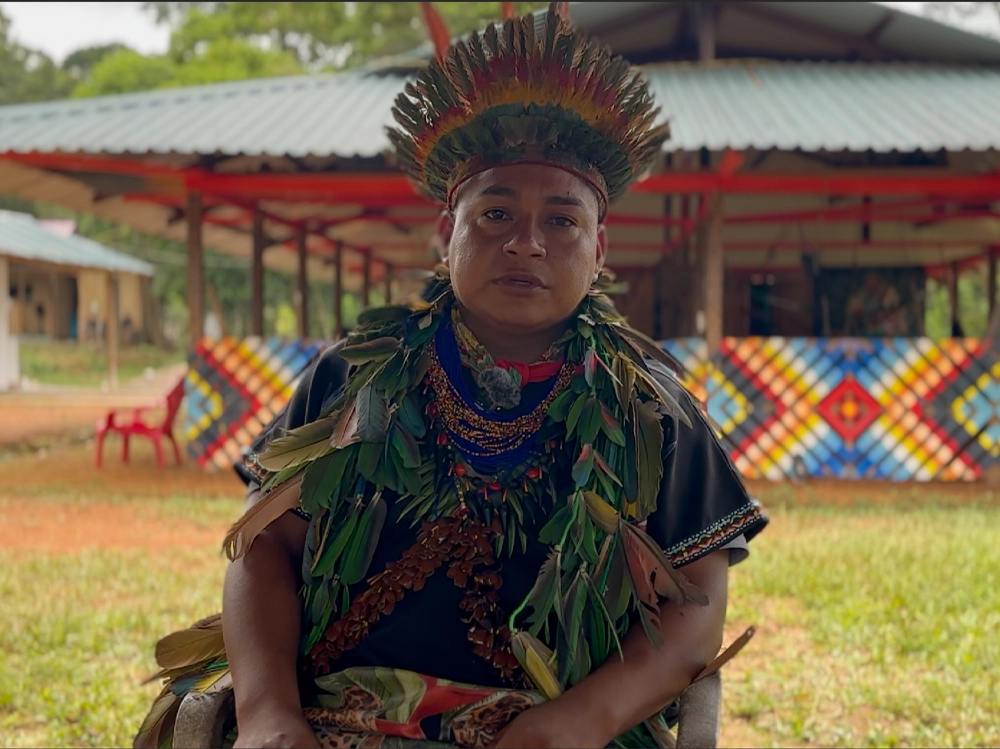 Taita Miguel of the Camsá tribe wearing traditional ceremonial attire at an ayahuasca retreat in Colombia.